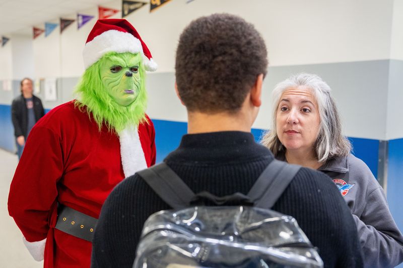 The Grinch assists Fairview Middle School Principal Mandi Mayer in disciplining a student Friday, Dec. 19, 2025.