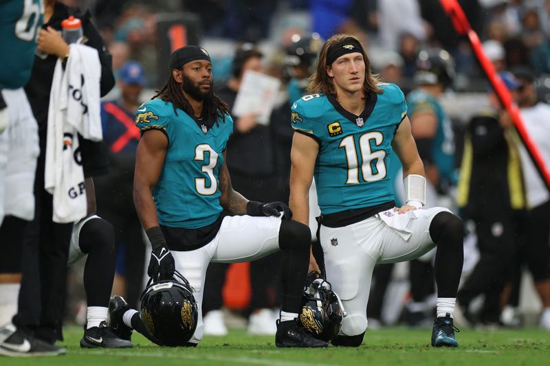 Dec 7, 2025; Jacksonville, Florida, USA; Jacksonville Jaguars wide receiver Jakobi Meyers (3) and quarterback Trevor Lawrence (16) take a knee during an injury time out in the first half against the Indianapolis Colts at EverBank Stadium. Mandatory Credit: Matt Pendleton-Imagn Images