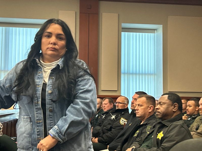 Dagmarie Aponte returns to her seat during a sentencing hearing in November 2025 for her husband, Jorge Rivera. Aponte is seeking to withdraw her no-contest plea to charges related to a confrontation with a Deltona Middle School deputy.