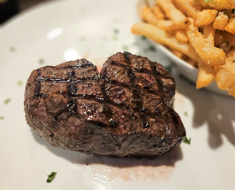 The filet mignon and truffle fries at Alpine Steakhouse, 4520 S. Tamiami Trail, Sarasota, photographed Dec. 3, 2025.