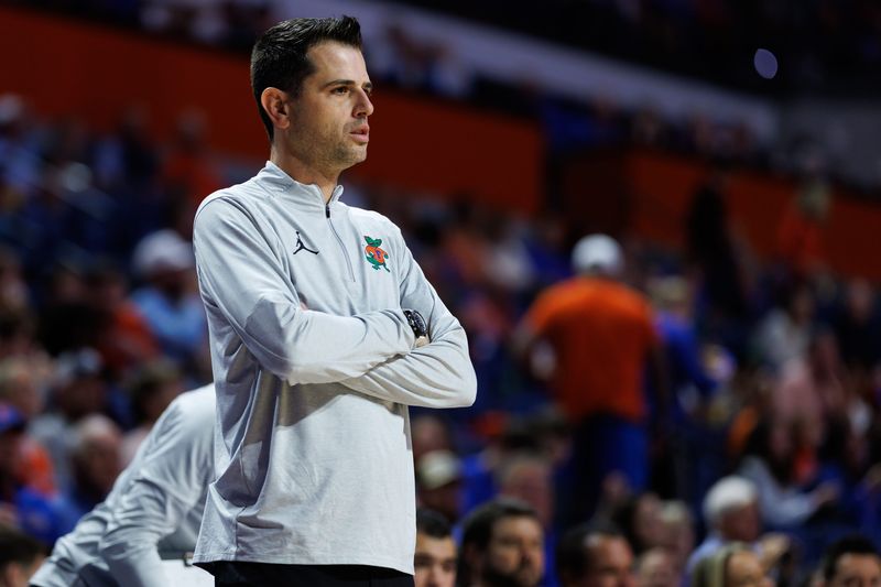 Dec 21, 2025; Gainesville, Florida, USA; Florida Gators head coach Todd Golden looks on against the Colgate Raiders during the first half at Exactech Arena at the Stephen C. O'Connell Center. Mandatory Credit: Matt Pendleton-Imagn Images