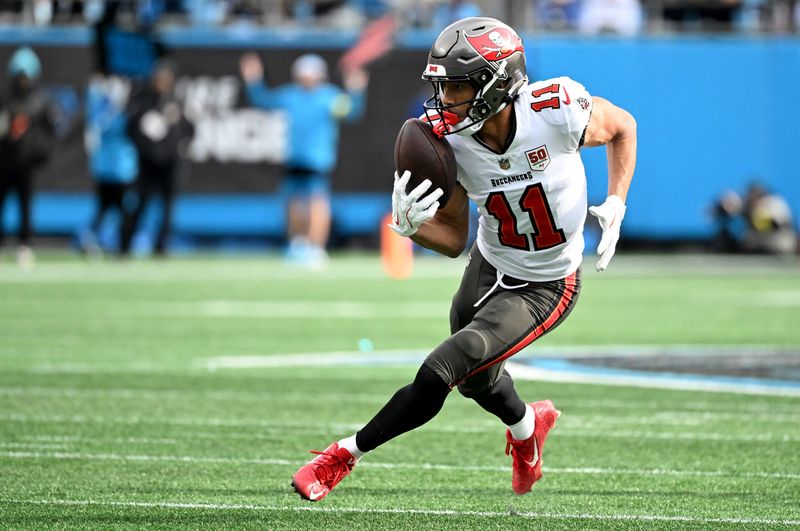 Dec 21, 2025; Charlotte, North Carolina, USA; Tampa Bay Buccaneers wide receiver Jalen McMillan (11) make a catch during the first half against the Carolina Panthers at Bank of America Stadium. Mandatory Credit: Bob Donnan-Imagn Images