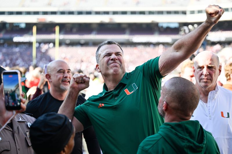 Dec 20, 2025; College Station, TX, USA; Miami Hurricanes head coach Mario Cristobal celebrates after defeating the Texas A&M Aggies in the first round game of the CFP National Playoff at Kyle Field. Mandatory Credit: Jerome Miron-Imagn Images