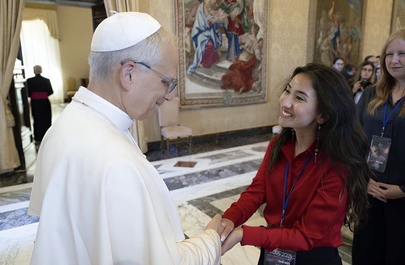 Isabella Macias shakes hands with Pope Leo XIV during a Summer 2025 audience the pope held with students of the Vatican Observatory Summer School. Macias, a graduate of Braden River High School in Bradenton and a current doctorate student at the Massachusetts Institute of Technology, cites the influence of the area nonprofit UnidosNow in empowering her to dream and achieve great things.