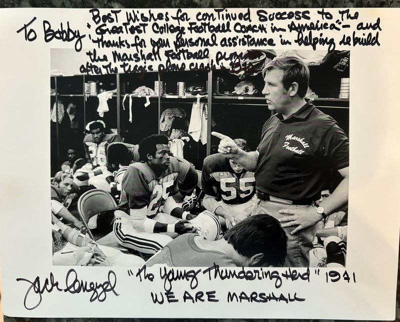 The Bobby Bowden Legacy Auction is tentatively scheduled for March 2026, giving fans the chance to own a piece of Bowden's legacy like this personalized photograph to Bowden, head coach at West Virginia at the time, from Marshall coach Jim Lengyel in 1971. Lengyel was hired after head coach Rick Tolley was killed along with 37 players and 38 other coaches, university administrators, school boosters, and flight crew members in a plane crash on November 14, 1970.