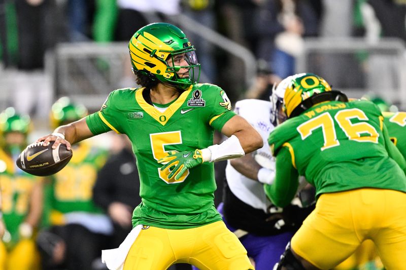 Dec 20, 2025; Eugene, OR, USA; Oregon Ducks quarterback Dante Moore (5) throws a pass during the first quarter against the James Madison Dukes at Autzen Stadium. Mandatory Credit: Troy Wayrynen-Imagn Images