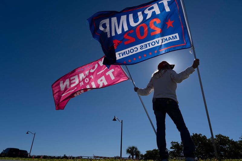 Dina Loury shows her support for President Trump near Mar-a-Lago in Palm Beach, Florida, after US forces captured Venezuela's leader Nicolas Maduro after bombing the capital Caracas on January 3, 2026.