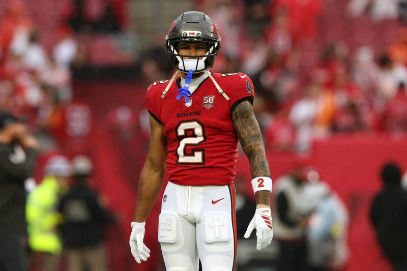 Jan 3, 2026; Tampa, Florida, USA; Tampa Bay Buccaneers wide receiver Emeka Egbuka (2) warms up before the game against the Carolina Panthers at Raymond James Stadium. Mandatory Credit: Nathan Ray Seebeck-Imagn Images
