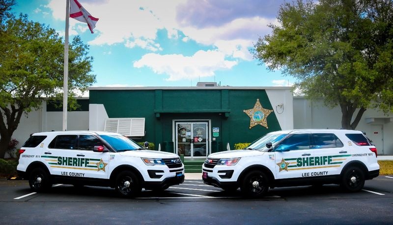Lee County Sheriffs Office vehicles in front of sheriff's office.