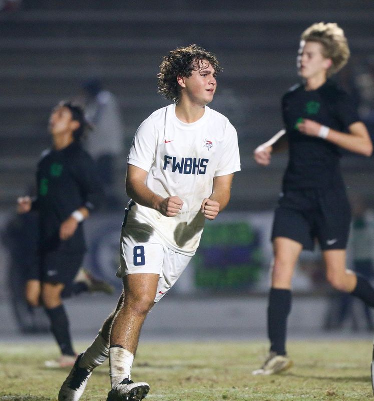 Fort Waltons Isaac Holbrook reacts after scoring on a penalty kick during the Choctaw Fort Walton Beach boys soccer match at Choctaw.