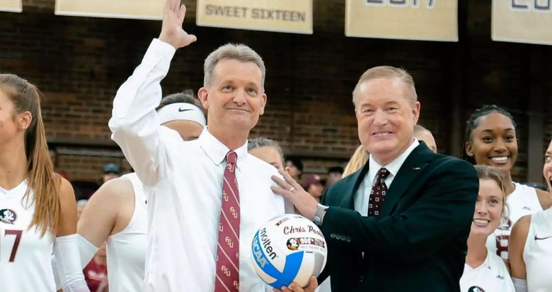 FSU volleyball coach Chris Poole (left) is with Michael Alford (right), Director of Athletics and Vice President.