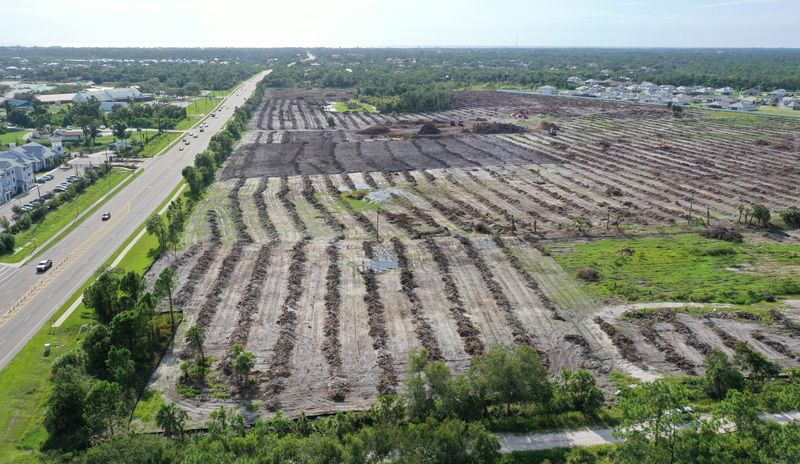 This Sept. 2025 aerial image shows land cleared for the 83-acre Venice Crossing Commercial Center. Twin Laurel Boulevard, a private road, can be seen at the bottom, while Laurel Road is at left. The Reserve at Venice, a 276-home apartment complex is at left.