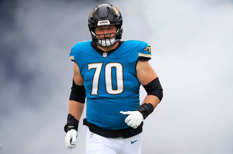 Jacksonville Jaguars offensive tackle Cole van Lanen (70) runs on the field before an NFL football matchup at EverBank Stadium, Sunday, Jan. 4, 2026, in Jacksonville, Fla. The Jaguars defeated the Titans 41-7, capturing the AFC South title. [Corey Perrine/Florida Times-Union]