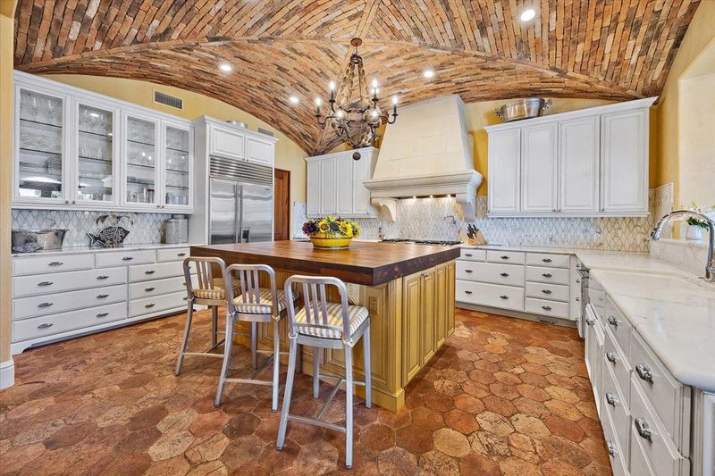 A barrel brick ceiling, inspired by Tuscan vineyards, is the highlight of the chef's kitchen, along with a walnut island topped with butcher block and a custom stone oven hood. It's featured in the home at 57 Ponte Vedra Blvd., which sold for the highest amount in 2025 for the Jacksonville area.