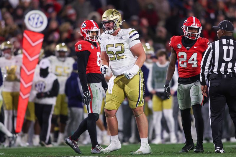 Nov 29, 2024; Athens, Georgia, USA; Georgia Tech Yellow Jackets offensive lineman Harrison Moore (52) reacts after a play against the Georgia Bulldogs in the third quarter at Sanford Stadium. Mandatory Credit: Brett Davis-Imagn Images