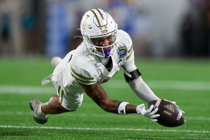 Dec 27, 2025; Orlando, FL, USA; Georgia Tech Yellow Jackets wide receiver Eric Rivers (3) catches a pass against the BYU Cougars in the third quarter during the Pop-Tarts Bowl at Camping World Stadium. Mandatory Credit: Nathan Ray Seebeck-Imagn Images