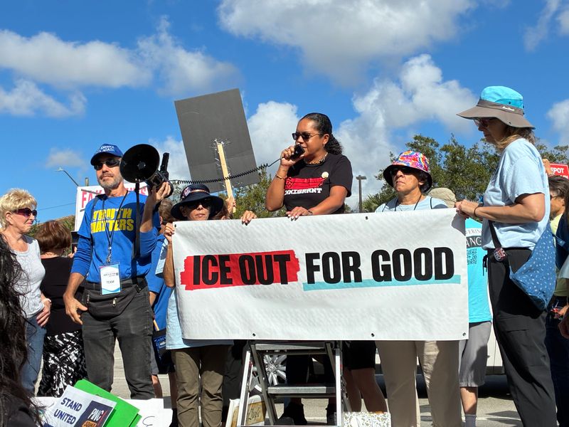 Tessa Petit, executive director of the Florida Immigration Coalition, calls on protesters to continue to oppose the overzealous enforcement of laws regarding immigrants in the U.S. without documentation at a rally in suburban Boca Raton on Jan. 10, 2026.