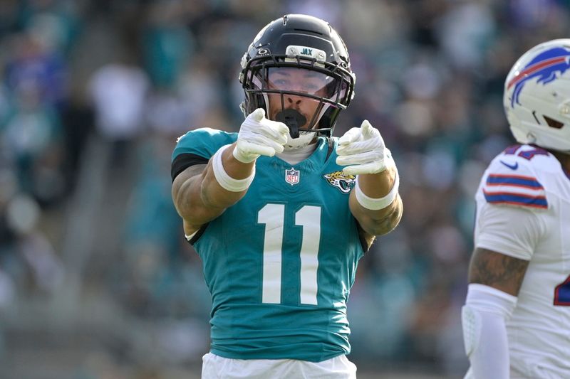 Jan 11, 2026; Jacksonville, FL, USA; Jacksonville Jaguars wide receiver Parker Washington (11) reacts during the second half against the Buffalo Bills in an AFC Wild Card Round game at EverBank Stadium. Mandatory Credit: Melina Myers-Imagn Images