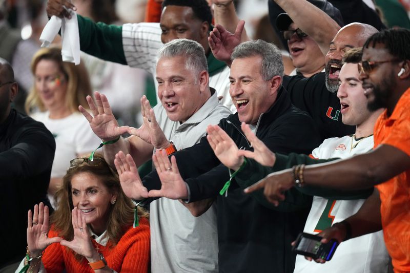 Fans cheer from the stands as the Ole Miss Rebels play the Miami Hurricanes during their Vrbo Fiesta Bowl matchup at State Farm Stadium on Jan. 8, 2026.