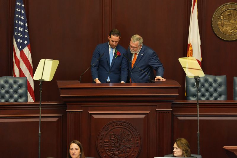 Speaker of the House Danny Perez, left, and Senate President Ben Albritton review notes before the joint session begins Tuesday, Jan. 13, 2026.