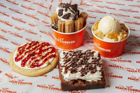 Assorted Peach Cobbler Factory menu items: Bigger & Better Cookie, Churro Six, Peach Cobbler and a Bigger & Better Brownie.
