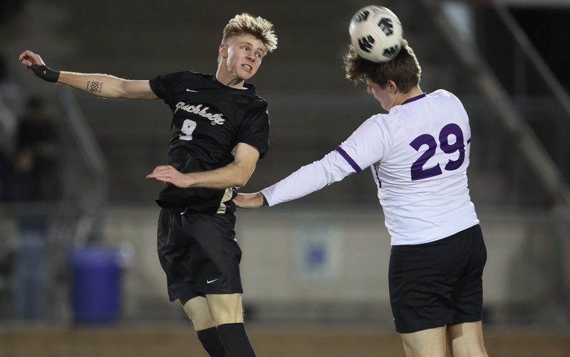 Buchholz Teague McNeal (9) and Gainesvilles defender Ian Woodend (29) head the ball during the Alachua Cup at Citizens Field in Gainesville, FL on Wednesday, January 14, 2026. [Alan Youngblood/Gainesville Sun]