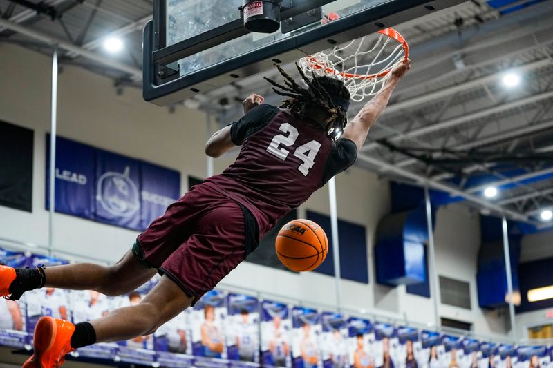 First Baptist Academy Lions guard Brock Bass-Bonner (24) dunks during the fourth quarter of a game against the Oasis Sharks at Oasis High School in Cape Coral, Fla., on Thursday, Jan. 15, 2026.