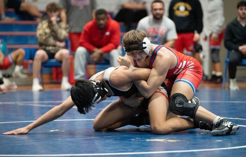 Pace Patriots Dominic Iacobellis takes on his opponent from Middleburg High School in the 150 pound weight class during the wrestling meet at Pace High School on Jan. 15, 2026.