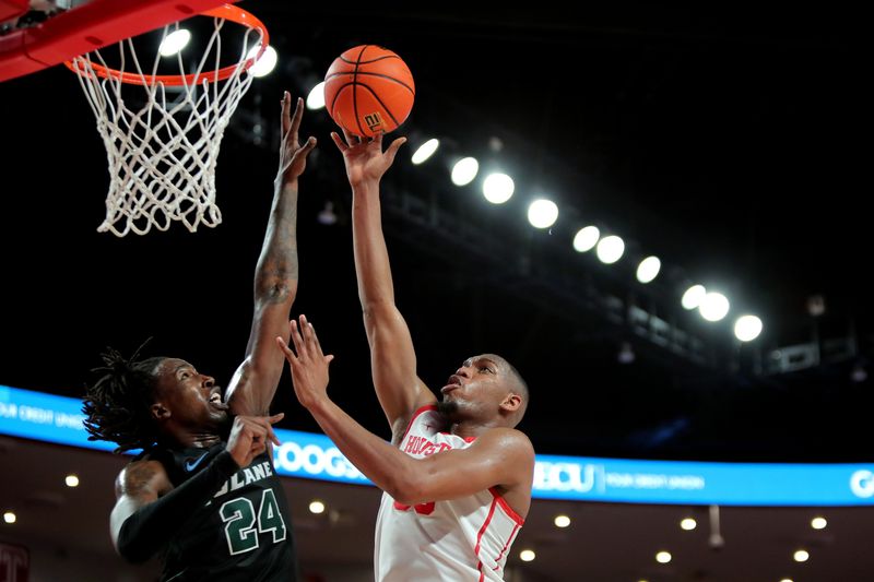 Feb 2, 2022; Houston, Texas, USA; Houston Cougars forward Fabian White Jr. (35) takes a shot while Tulane Green Wave forward Kevin Cross (24) defends during the second half at Fertitta Center. Mandatory Credit: Erik Williams-USA TODAY Sports