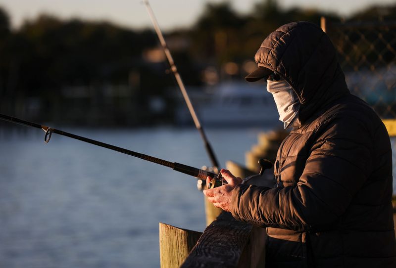 People bundle up to keep warm on a cold morning at Sandsprit Park, Jan. 16, 2026, in Martin County.