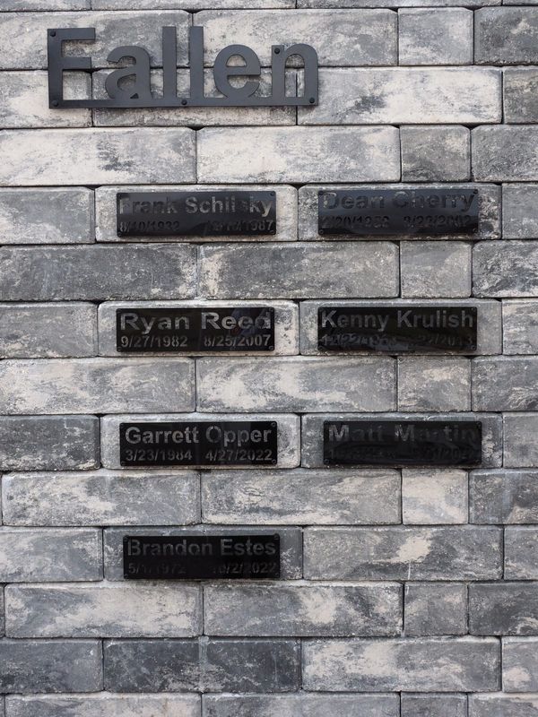 Plaques of St. Johns County's fallen firefighters: Frank Schilsky (12/18/1987), Dean Cherry (8/22/2002), Ryan Reed (8/25/2007), Kenny Krulish (1/22/2013), Garrett Opper (4/27/2022), Matt Martin (8/21/2022) and Brandon Estes (10/2/2022).