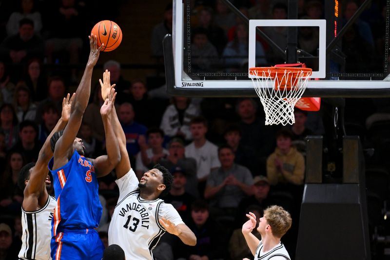 Jan 17, 2026; Nashville, Tennessee, USA; Florida Gators center Rueben Chinyelu (9) shoots over Vanderbilt Commodores forward Jalen Washington (13) and forward Ak Okereke (10) during the second half at Memorial Gymnasium. Mandatory Credit: Steve Roberts-Imagn Images