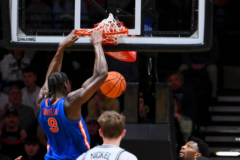 Jan 17, 2026; Nashville, Tennessee, USA; Florida Gators center Rueben Chinyelu (9) dunks the ball against the Vanderbilt Commodores during the second half at Memorial Gymnasium. Mandatory Credit: Steve Roberts-Imagn Images