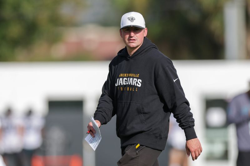 Jul 25, 2025; Jacksonville, FL, USA; Jacksonville Jaguars offensive coordinator Grant Udinski leads training camp at Miller Electric Center. Mandatory Credit: Nathan Ray Seebeck-Imagn Images