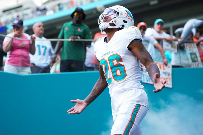 Oct 12, 2025; Miami Gardens, Florida, USA; Miami Dolphins cornerback Rasul Douglas (26) enters the field prior to a game against the Los Angeles Chargers at Hard Rock Stadium. Mandatory Credit: Rich Storry-Imagn Images