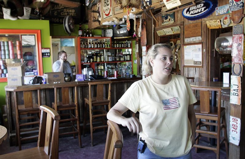 Sherry Wintker, owner of Harry A's Bar on St. George Island says they are hoping to salvage what's left of the tourist season after hurricanes in this file photo from 2005.