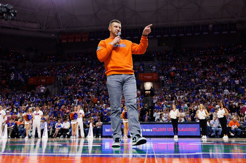 Jan 24, 2026; Gainesville, Florida, USA; Florida Gators Football head coach Jon Sumrall addresses the crowd during a timeout against the Auburn Tigers during the first half at Exactech Arena at the Stephen C. O'Connell Center. Mandatory Credit: Matt Pendleton-Imagn Images