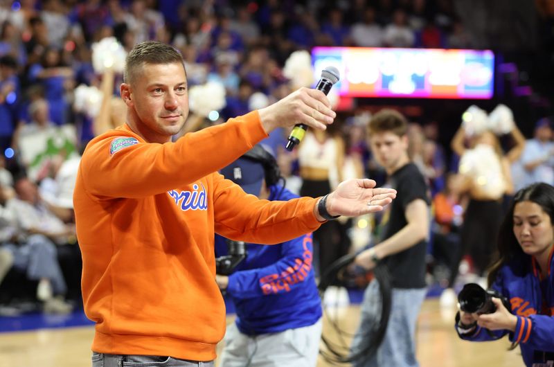 New Gator head football coach Jon Sumrall fires up the crowd during the first half an NCAA basketball game at Steven C. O'Connell Center Exactek arena in Gainesville, FL on Saturday, January 24, 2026. Auburn won 76-67 [Alan Youngblood/Gainesville Sun]