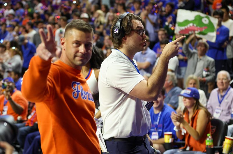 New Gator head football coach Jon Sumrall fires up the crowd during the first half an NCAA basketball game at Steven C. O'Connell Center Exactek arena in Gainesville, FL on Saturday, January 24, 2026. Auburn won 76-67 [Alan Youngblood/Gainesville Sun]