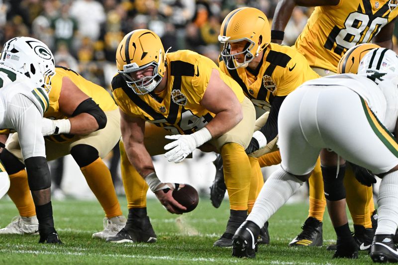 Oct 26, 2025; Pittsburgh, Pennsylvania, USA; Pittsburgh Steelers center Zach Frazier (54) snaps the ball to quarterback Aaron Rodgers (8) against the Green Bay Packers during the second half at Acrisure Stadium. Mandatory Credit: Barry Reeger-Imagn Images
