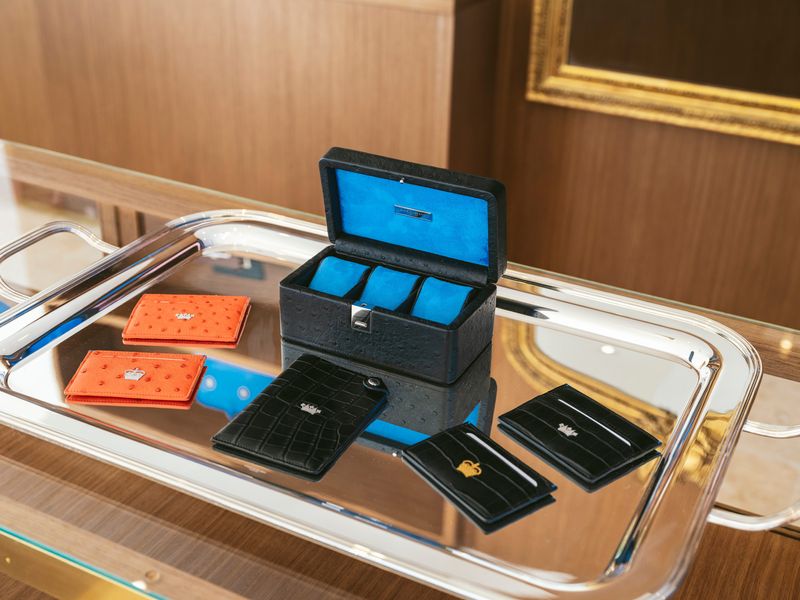 Passport holders and card wallets are among the items for sale at the new Christopher King store in Palm Beach.