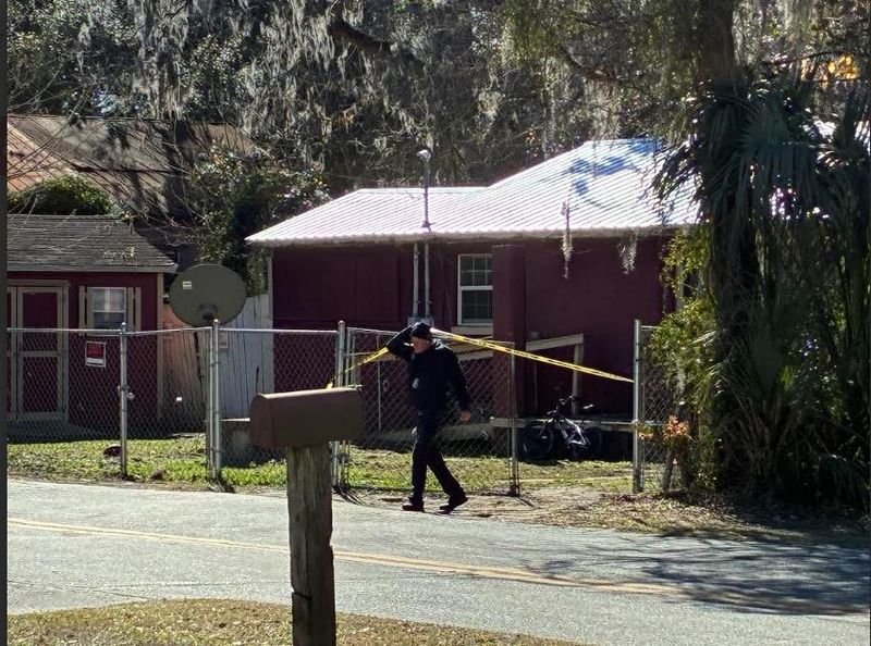 An Ocala Police Department official is shown leaving the scene of where a body was discovered in northwest Ocala on Jan. 27, 2026.