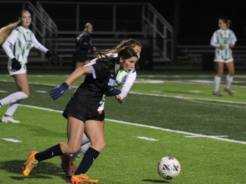 Ponte Vedra forward Lily Morse (7) tries to spin away from Beachside midfielder Alara Kiziltas (1) during an FHSAA District 4-5A girls soccer final on Jan. 27, 2026. [Clayton Freeman/Florida Times-Union]