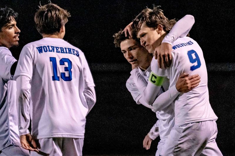 The Palm Beach Central High School Broncos (in dark uniforms) hosted the Wellington Community High School Wolverines in Florida High School Athletic Association boys varsity soccer for the District 13-7A championship in Wellington, Fla., on January 27, 2026. The Wolverines won the match 3-1.