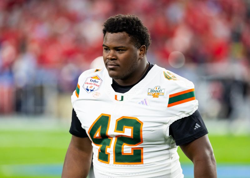 Jan 8, 2026; Glendale, AZ, USA; Miami Hurricanes defensive lineman Artavius Jones (42) against the Mississippi Rebels during the 2026 Fiesta Bowl and semifinal game of the College Football Playoff at State Farm Stadium. Mandatory Credit: Mark J. Rebilas-Imagn Images
