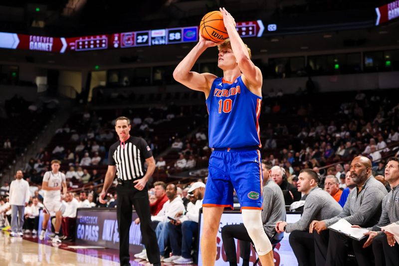 Jan 28, 2026; Columbia, South Carolina, USA; Florida Gators forward Thomas Haugh (10) makes a three point basket against the South Carolina Gamecocks in the second half at Colonial Life Arena. Mandatory Credit: Jeff Blake-Imagn Images