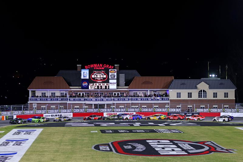 Drivers race through Turns 3 and 4 at Bowman Gray Stadium during qualifying for the 2025 NASCAR Cook Out Clash.