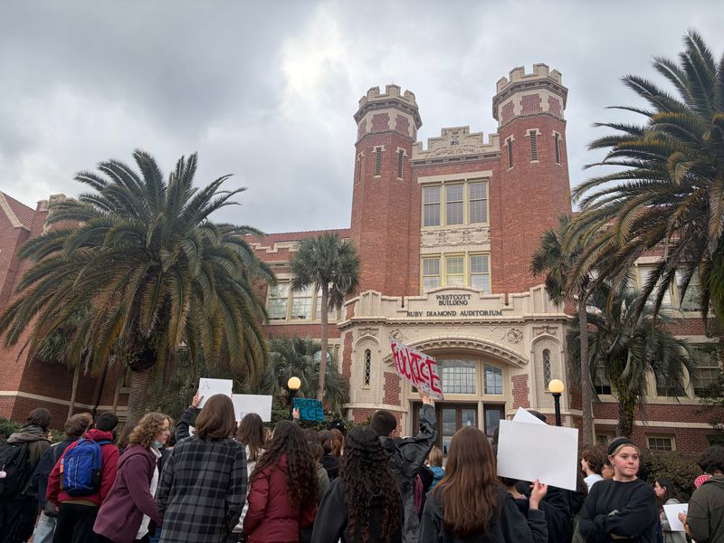 Protestors gather outside the Westcott Building to demand FSU sees petition.