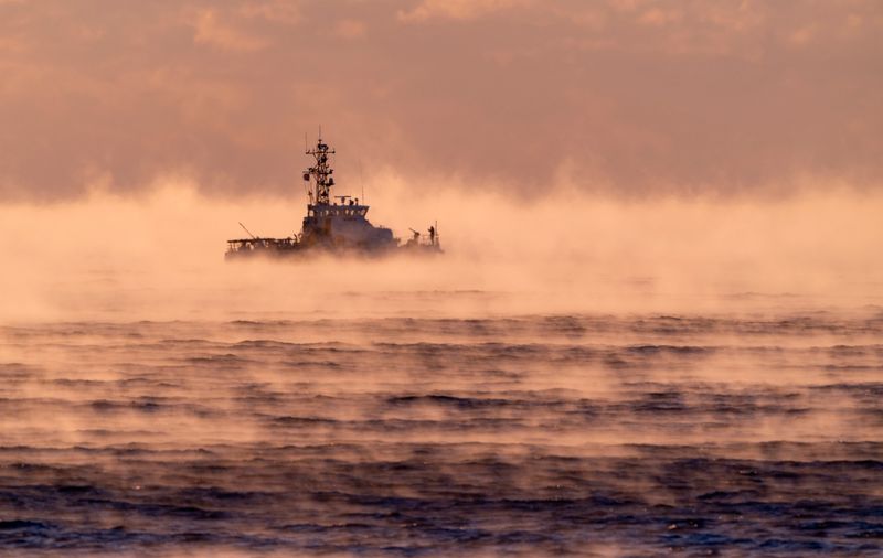 A U.S. Coast Guard boat is shrouded by steam as temperatures dipped near freezing. The crew was patrolling the ocean near Mar-a-Lago while President Trump is in town on February, 2026, in Palm Beach, Florida.
