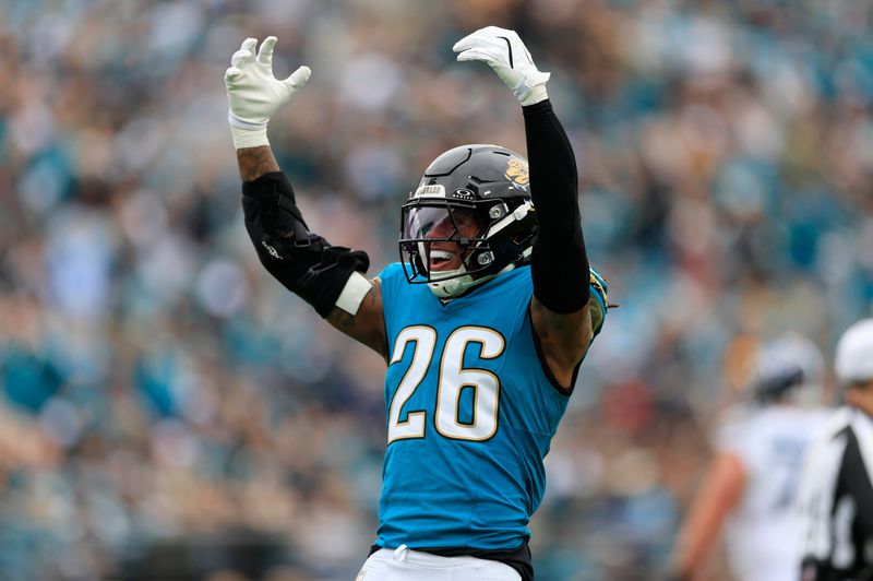 Jacksonville Jaguars safety Antonio Johnson (26) reacts to his tackle during the first quarter of an NFL football matchup at EverBank Stadium, Sunday, Jan. 4, 2026, in Jacksonville, Fla. The Jaguars defeated the Titans 41-7, capturing the AFC South title.